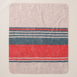 Textur aus Strickwaren mit roten Streifen Sherpadecke