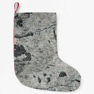 Textur einer alten gebrochenen Betonwand. Hintergr Kleiner Weihnachtsstrumpf