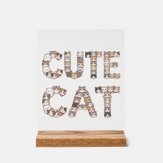 The words "CUTE CAT" are made using cat faces Acrylschild