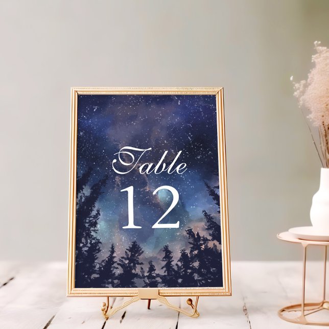 Tischnummern der Hochzeit von Starry Night Forest (Starry Night Forest Wedding Table Numbers on a white wooden table in a golden frame.)