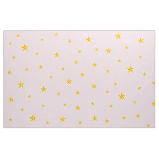 Tissu Étoiles dorées éparpillées sur rose clair