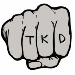 TKD Faustverzierung Fotoskulptur Ornament<br><div class="desc">Das TKD Faustschmuck ist eine einzigartige taekwondo Geschenkidee für einen Geburtstag,  Weihnachten,  Feiertag oder Gürteltrangliste Werbeaktion Test oder Prüfung. Dieses Kampfkunstschmuck hat ein erstes Design in einem mittleren Punch (mit freundlicher Genehmigung von designious.com) mit den Buchstaben,  die auf den Knöcheln getickt werden.</div>