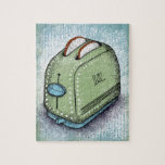 Toaster Jigsaw Puzzle<br><div class="desc">Toaster in grün und blau mit 2 Scheiben weißes Brot,  das aus den Löchern schaut. Dieses kleine Küchengerät sitzt auf einem blau-grün gestreiften Hintergrund.</div>