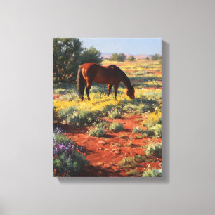 Toile Cheval pâturant dans le désert de fleurs sauvages 