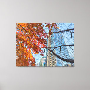 Toile Feuilles d'automne rouges et paysage urbain à l'ho