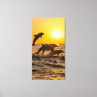 Toile groupe de dauphins saute joyeusement des vagues