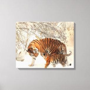 Toile Mignonne mère tigre avec un bébé en neige