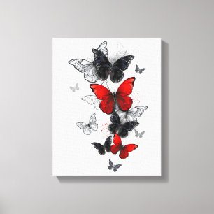 Toile Papillons noirs et rouges volants