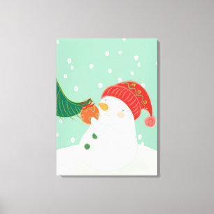Toile Un bonhomme de neige accrochant un ornement sur un