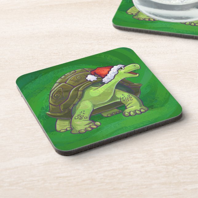 Tortoise in der Weihnachtsmannmütze auf grün Untersetzer (Linke Seite)