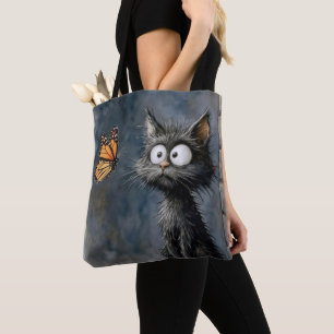 Tote Bag Chat dépenaillé fixant un papillon