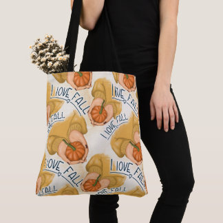TOTE BAG FEMME EN SWÉTER OR TENANT UN PETIT CITROUILLE