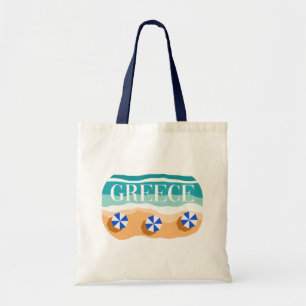 Tote Bag Grèce : Plage de sable avec Parasols Bleus et Vagu