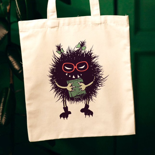 Tote Bag Personnage maléfique amateur de livres gothiques (canvas tote closeup on dark green background with evil character with ponytails grinning with book)