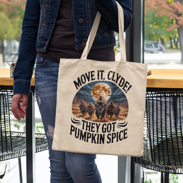 Tote Bag Pumpkin Spice Coffee Funny Bison Stampede (woman in a coffee shop holding funny pumpkin spice humor tote bag)