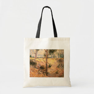 Tote Bag Un arbre dans un champ pendant la journée ensoleil