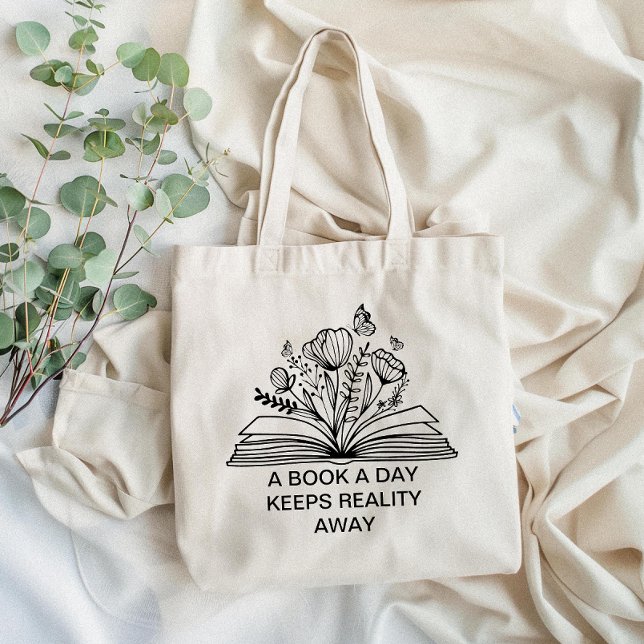 Tote Bag Un livre par jour garde la réalité loin du design  (Carry your love for reading with our tote bag featuring a witty book quote—perfect for book lovers!)