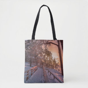 Tote Bag Winter sunset in pine forest near sea