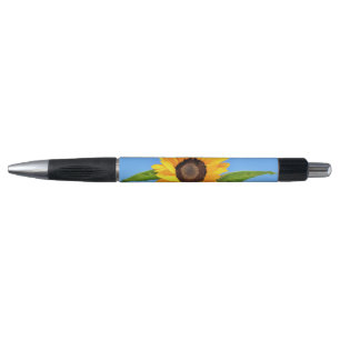 Tournesol jaune contre soleil sur stylo bleu ciel