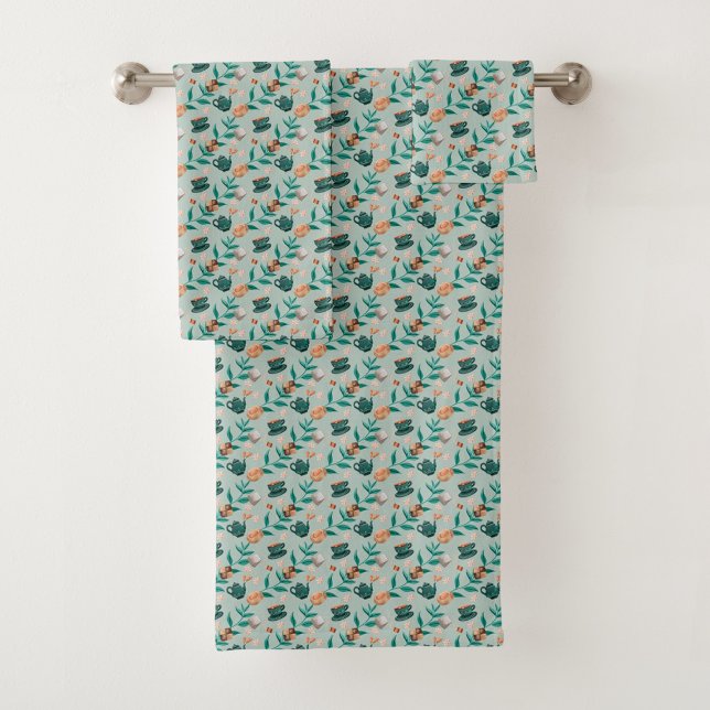Towels with a teal floral pattern hang  (Créateur téléchargé)