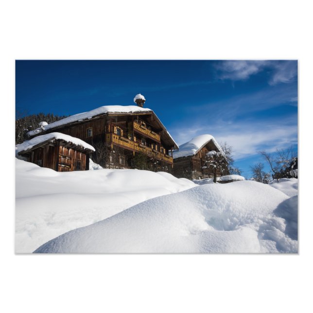 Traditionelle Holzhütten im Schnee Fotodruck (Vorne)