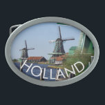 Traditionelles Grün-Weiß-Windmühlen-Foto Ovale Gürtelschnalle<br><div class="desc">Besuchen Sie die berühmten Holzwindmühlen des Freilichtmuseums Zaanse Schans, wenn Sie im Urlaub oder im Urlaub in Holland sind. Das sind echte, funktionierende originale Windmühlen aus dem Goldenen Zeitalter Hollands. Die Region Zaan leitet sich vom Fluss Zaan ab, einem breiten und faulen Feuchtgebiet, an dem sich viele Siedlungen befinden. Aufgrund...</div>