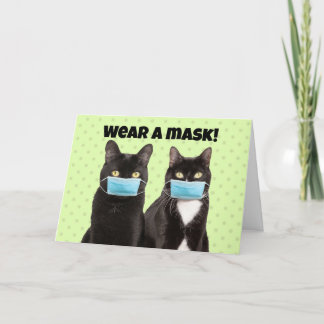 Tragen Sie eine Maske Niedliche Katze in Coronavir Karte