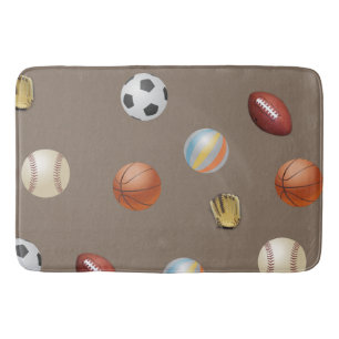 Trägt des Balls auf einer Badmatte zur Schau Badematte