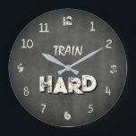 Train Hard Industrial Gym Große Wanduhr<br><div class="desc">This bold Train Hard wall clock features a dark concrete style background that brings an industrial gym atmosphere into your space. The textured grey surface combined with elegant ivory numbers and typography creates a strong yet clean fitness-inspired design. The minimalist motivational phrase Train Hard makes this clock a perfect addition...</div>