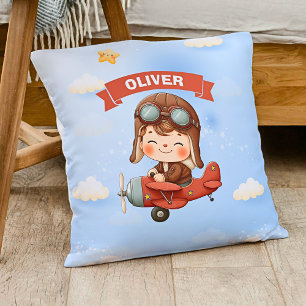 Träumendes Baby Aviator in rotem Flugzeug Kissen