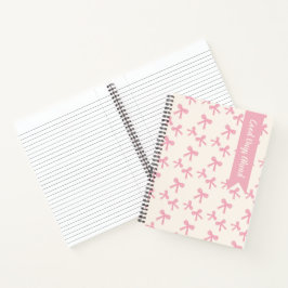 Träumendes Notizbuch mit rosa Schleife und handgez