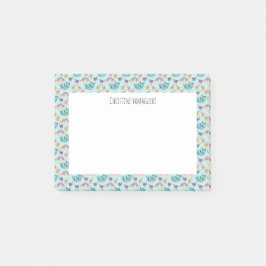 Träumerische Katze, die in das Post-it Klebezettel