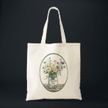 Trauzeugin Wildblumen in Mason Jar Tragetasche<br><div class="desc">Diese rustikale Glaskeramik ist eine wunderschöne Art, eine Trauzeugin zu ehren. Sie ist mit Aquarellfarben-Wildblumen in sanften Rosa und lila Farbtönen gefüllt. Das Label des Jars zeichnet sich durch "Trauzeugin" aus, mit bearbeitbarem Text, der für andere Hochzeitsrollen oder kurze Phrasen angepasst werden kann. Perfekt als Brautparty dank Geschenk, Hochzeitsnacht, oder...</div>