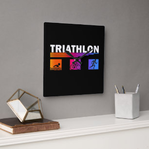 Triathlon: Schwimmen meistern, Fahrrad fahren, lau Quadratische Wanduhr