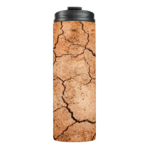 Trockenheit auf dem Boden der Erde Thermosbecher