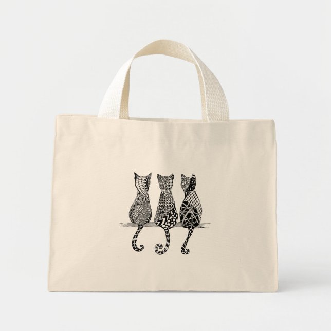 Trois chats noirs et blancs sur un sac (Devant)