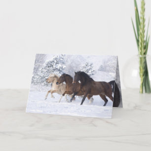 Trois chevaux courent dans la carte de voeux de ne