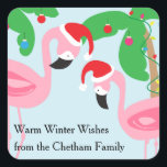 Tropical Beach Christmas Flamingos Birds Quadratischer Aufkleber<br><div class="desc">Weihnachtsaufkleber zum Thema Strand mit rosa Flamingo-Vögeln,  die Weihnachtsmannmützen tragen. Ornamente und Lichter schmücken die Palmen. Mit diesen lustigen und skurrilen Labels können Sie Ihren Freunden und Ihrer Familie warmen Winterjubeln schenken. Copyright Bendel Creative Design LLC Alle Rechte vorbehalten.</div>
