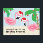 Tropical Beach Christmas Flamingos Feiertagspostkarte<br><div class="desc">Weihnachten zum Thema Beach mit rosa Flamingos mit Weihnachtsmannmützen. Ornamente und Lichter schmücken die Palmen. Mit diesen lustigen und skurrilen Karten können Sie Ihren Lieben warmen Winterjubeln. Copyright Bendel Creative Design LLC Alle Rechte vorbehalten.</div>