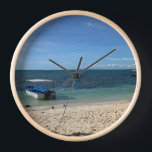 Tropical Blue Ocean Beach & Boat:Summer Wall Clock Uhr<br><div class="desc">Escape to a serene tropical paradise with this stunning photograph of a crystal-clear blue ocean and a peaceful boat resting near the shore. The pristine white sand and the gentle gradient of the sea create a calming, minimalist aesthetic. Perfect for adding a touch of summer vacation to your phone case,...</div>