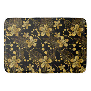 Tropische Blätter und Blume in Schwarz und Gold Badematte