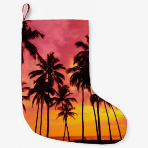 Tropischer Sonnenuntergang: Silhouette in Palm. Kleiner Weihnachtsstrumpf