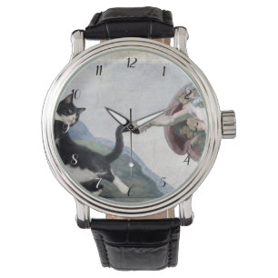 Tuxedo-Katze berührt die göttliche Pfote Armbanduhr