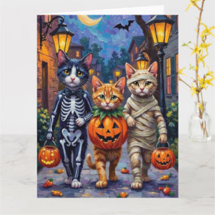 Tuxedo-Katzen beim Trick-or-Treat in Halloween-Kos Karte