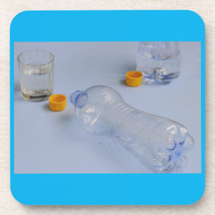 two bottles emptied on hard plastic coaster untersetzer
