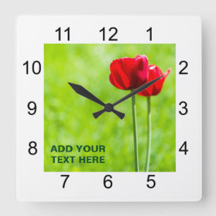 Two red tulip flowers quadratische wanduhr