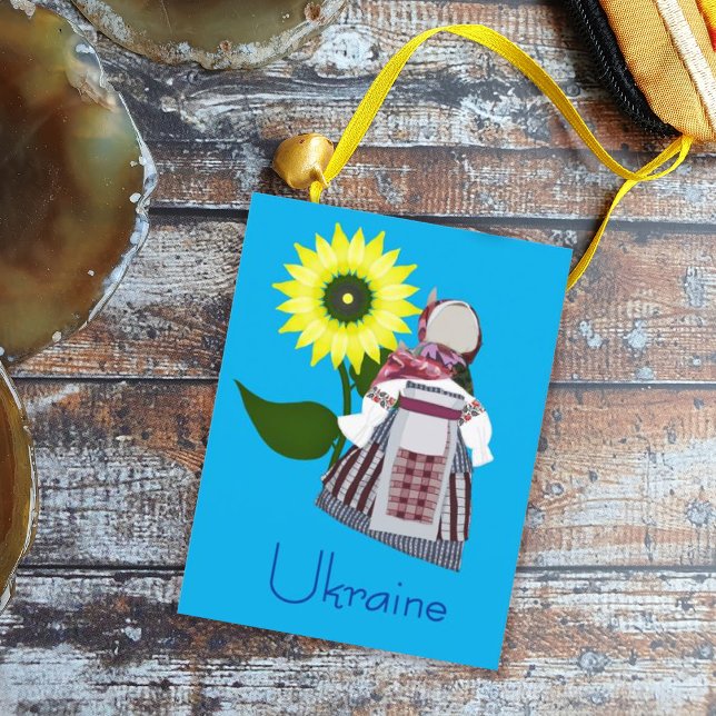 Ukrainische Volkspuppe mit Sonnenblume, Motanka. Postkarte (Von Creator hochgeladen)