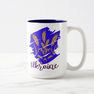 Ukrainisches Nationalsymbol tryzub aus Weizenohr Zweifarbige Tasse