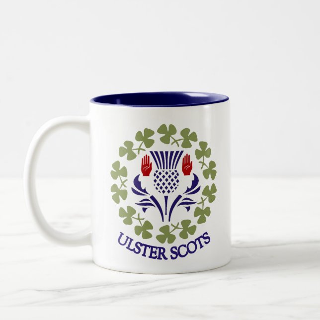 Ulster-Schotten Distel u. Kleeblatt-Tasse Zweifarbige Tasse (Links)