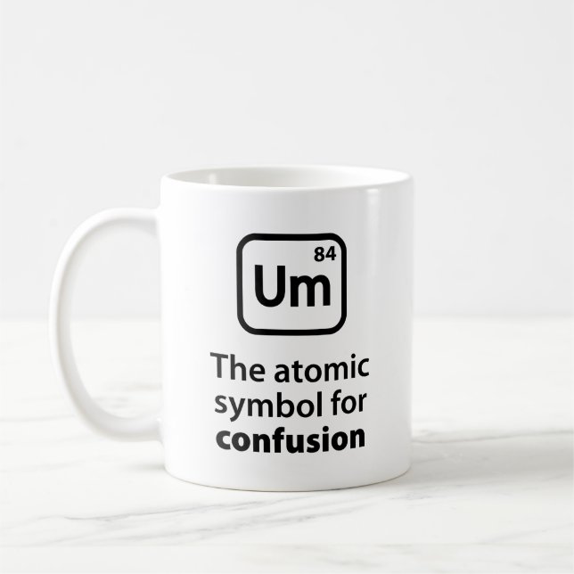 Um Le Symbole Atomique Pour La Mug De Café Confusi (Gauche)